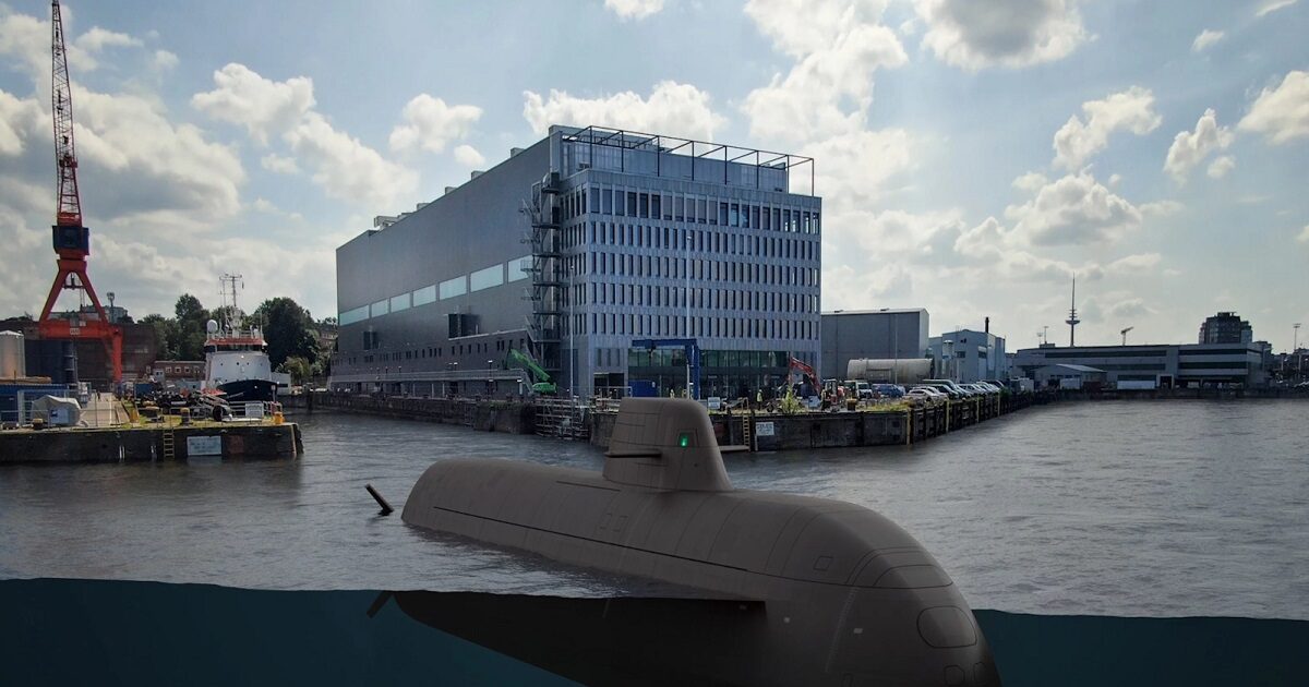 Type 212CD submarine in a port with buildings behind